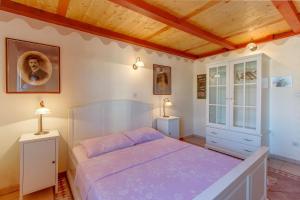 Ένα ή περισσότερα κρεβάτια σε δωμάτιο στο Apartments Popi