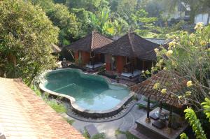 an aerial view of a house with a swimming pool at Padangbai Beach Homestay in Padangbai