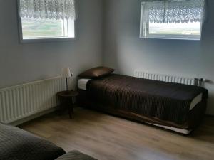 Letto o letti in una camera di Lamb Inn Öngulsstadir