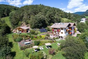 an aerial view of a house with a garden at Appartements Plattnerhof in Castelrotto