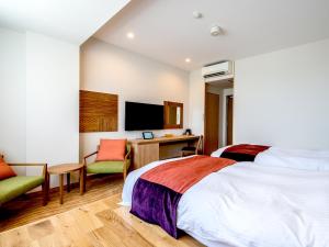 A bed or beds in a room at TKP Lectore Atami Momoyama
