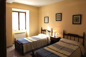 A bed or beds in a room at Casa Rural Bordaberea