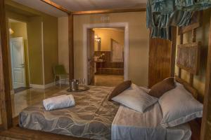 a bedroom with a large bed in a room at Chiaia 205 in Naples