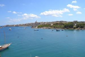 a large body of water with boats in it at Pebbles Boutique Aparthotel in Sliema