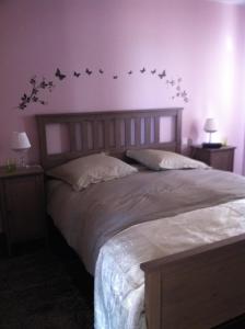 Postel nebo postele na pokoji v ubytování Le petit manoir