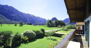 a view of a garden with mountains in the background at Pension mit Bergblick in Inzell in Inzell