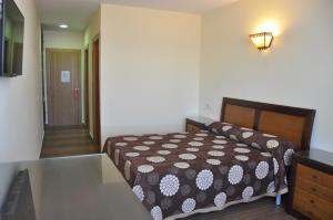 Säng eller sängar i ett rum på Hotel de Alba