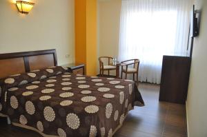 Postel nebo postele na pokoji v ubytování Hotel de Alba