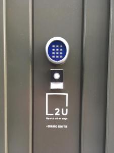 a close up of a machine with a remote control at 2U Oporto Urban Stays in Porto