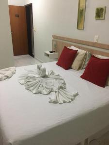 Giường trong phòng chung tại Hotel Conde Alemao