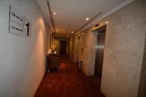 a hallway of a hotel with a hallway at Hayah Grand Hotel Ex Al Jaad Madinah Hotel in Medina