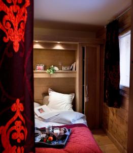 Postel nebo postele na pokoji v ubytování CGH Résidences & Spas l'Orée des Neiges