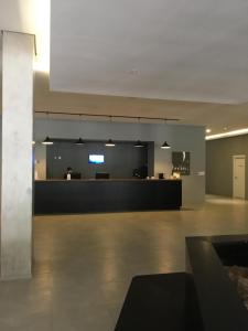 a lobby with a reception desk in a building at Granja Brasil in Itaipava +53 photos