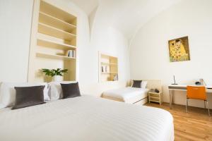 מיטה או מיטות בחדר ב-myNext - Johannesgasse Apartments