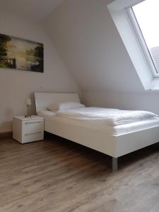 Postel nebo postele na pokoji v ubytování Boardinghouse Waldbronn
