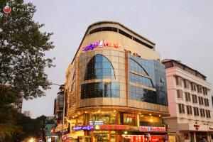 a building with a lot of lights on it at Empire International Church Street in Bengaluru
