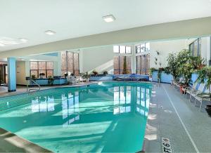 a large swimming pool in a large building at Ski In/Out Trailside Townhome in Killington