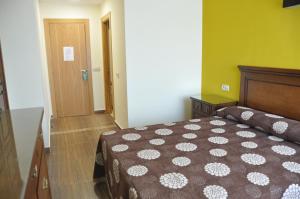 Postel nebo postele na pokoji v ubytování Hotel de Alba