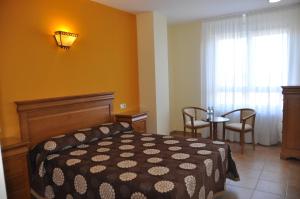 Postel nebo postele na pokoji v ubytování Hotel de Alba