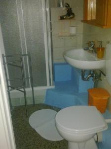 a bathroom with a toilet and a sink at Guest House Erika in La Spezia