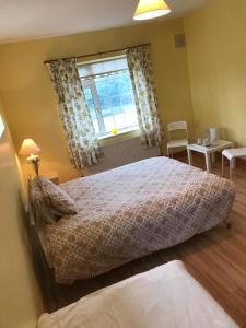 Postel nebo postele na pokoji v ubytování Oakwood B&B