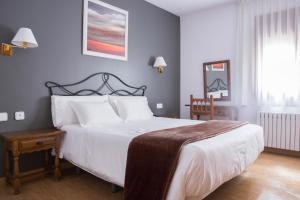 Postel nebo postele na pokoji v ubytování Hotel Bruna