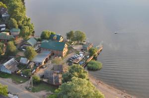 an aerial view of a house on an island in the water at Domiki u plyazha in Ostashkov