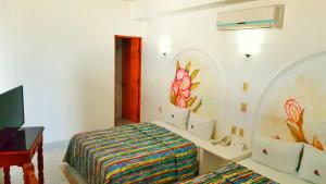 Postel nebo postele na pokoji v ubytování Hotel La Alondra