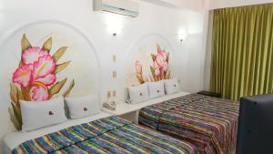 Postel nebo postele na pokoji v ubytování Hotel La Alondra