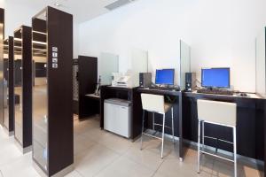 Telewizja i/lub zestaw kina domowego w obiekcie Cross Wave Umeda