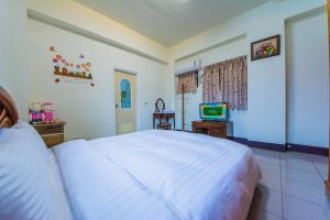 Cama o camas de una habitación en Happy Garden Homestay