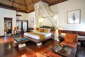 A bed or beds in a room at Arma Museum & Resort, CHSE Certified