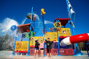 a group of people standing in front of a water park at BIG4 Saltwater @ Yamba Holiday Park in Yamba