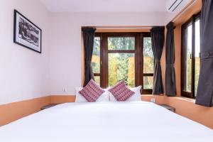 Letto o letti in una camera di The Museum