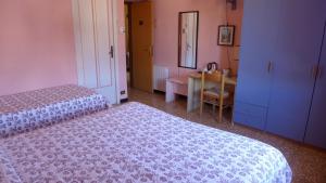 Postel nebo postele na pokoji v ubytování Bed and Breakfast Gioiello