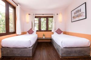 Letto o letti in una camera di The Museum