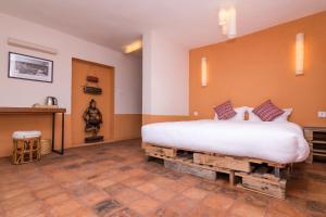 Letto o letti in una camera di The Museum