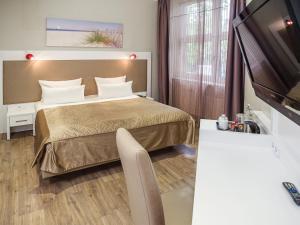 Voodi või voodid majutusasutuse Hotel Domicil Hamburg by Golden Tulip toas