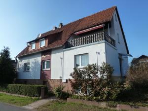 a white house with a brown roof at Landhaus Stümpelstal in Marburg an der Lahn