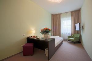 Postel nebo postele na pokoji v ubytování AKTIVHOTEL Weisser Hirsch