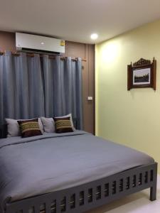 Katil atau katil-katil dalam bilik di Smilingface guesthouse