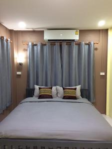 Katil atau katil-katil dalam bilik di Smilingface guesthouse
