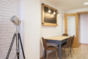 A television and/or entertainment centre at Apartment Beach Front Canet