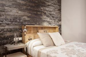 A bed or beds in a room at Apartment Beach Front Canet