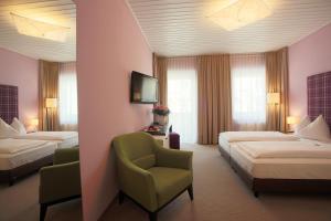 Postel nebo postele na pokoji v ubytování AKTIVHOTEL Weisser Hirsch