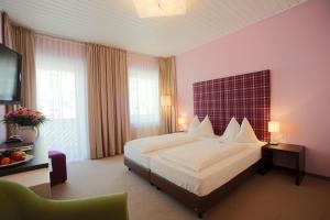 Postel nebo postele na pokoji v ubytování AKTIVHOTEL Weisser Hirsch