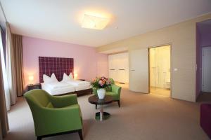Postel nebo postele na pokoji v ubytování AKTIVHOTEL Weisser Hirsch