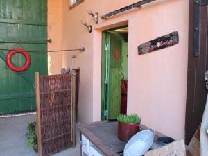 an entrance to a house with a green door at Wohnung in Ribnitz Damgarten in Ribnitz-Damgarten