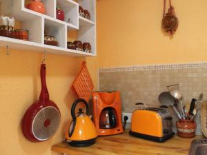 a kitchen counter with various appliances on it at Wohnung in Ribnitz Damgarten in Ribnitz-Damgarten +32 photos