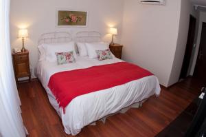 
A bed or beds in a room at Hotel Papiros
